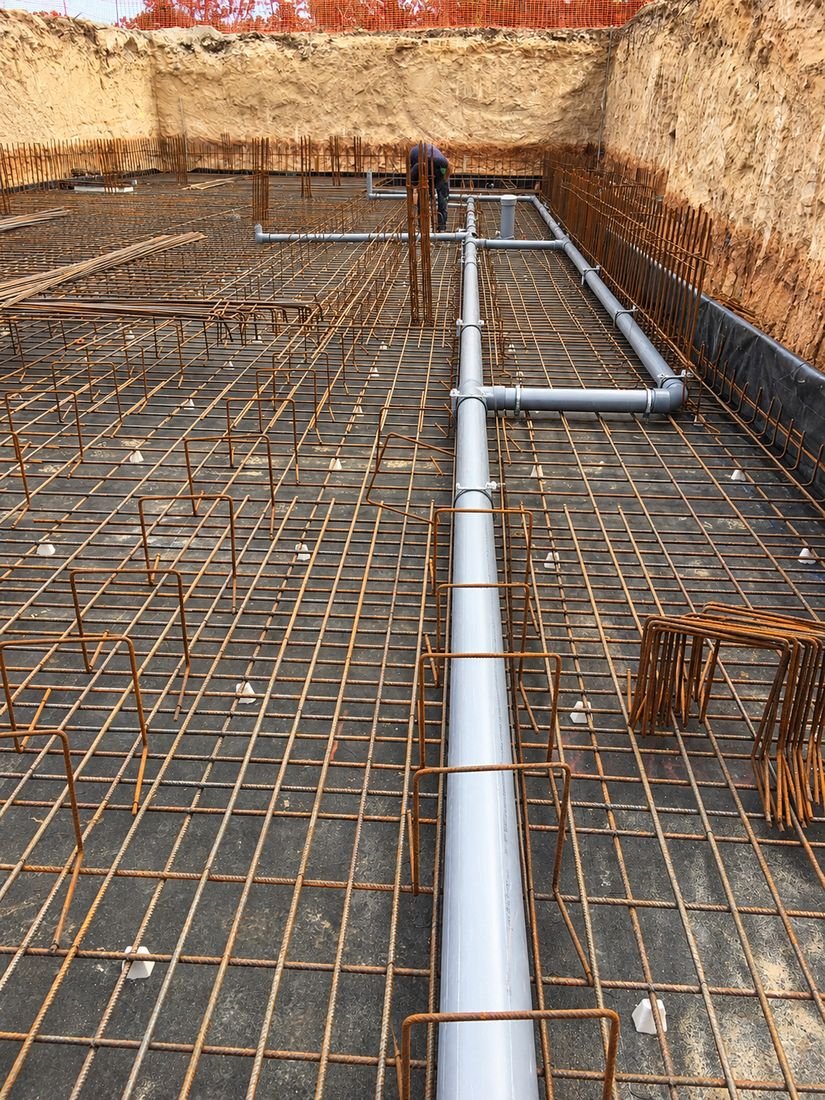 Pipes laid in the foundations before concreting